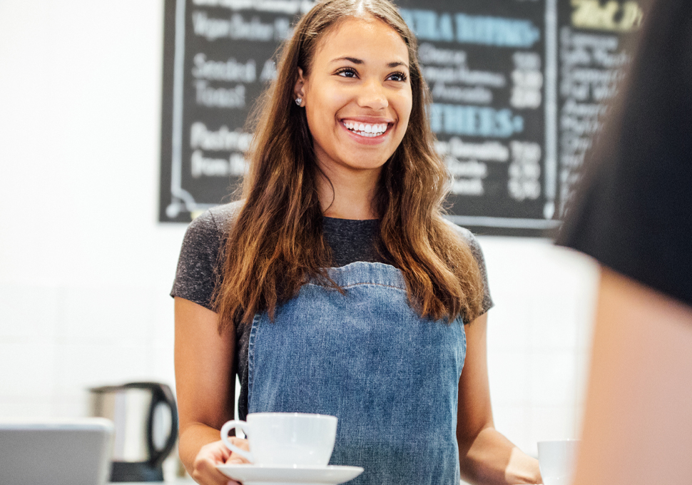 Employee serving a beverage
